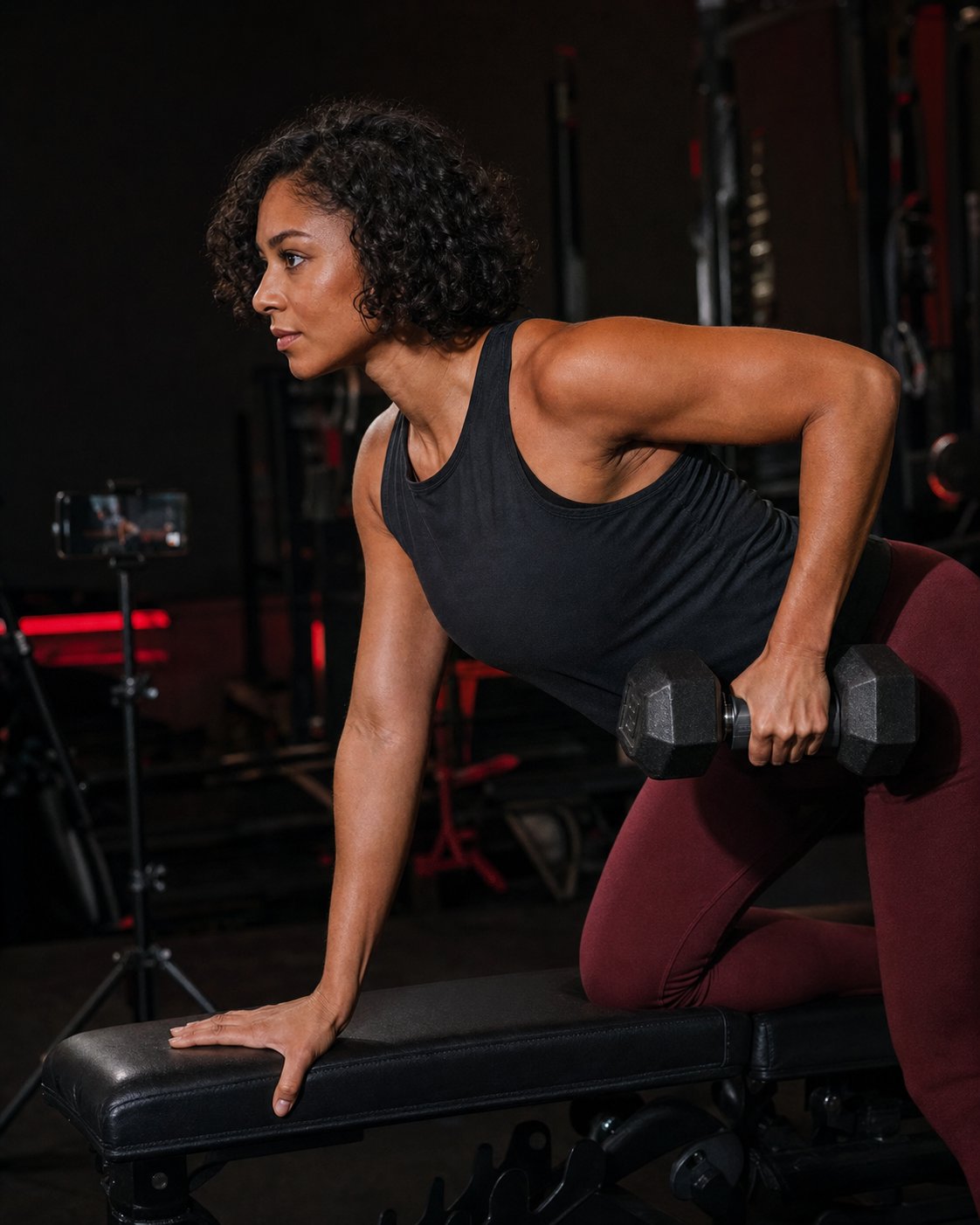 Athlete doing a dumbbell row with Marvel Grip